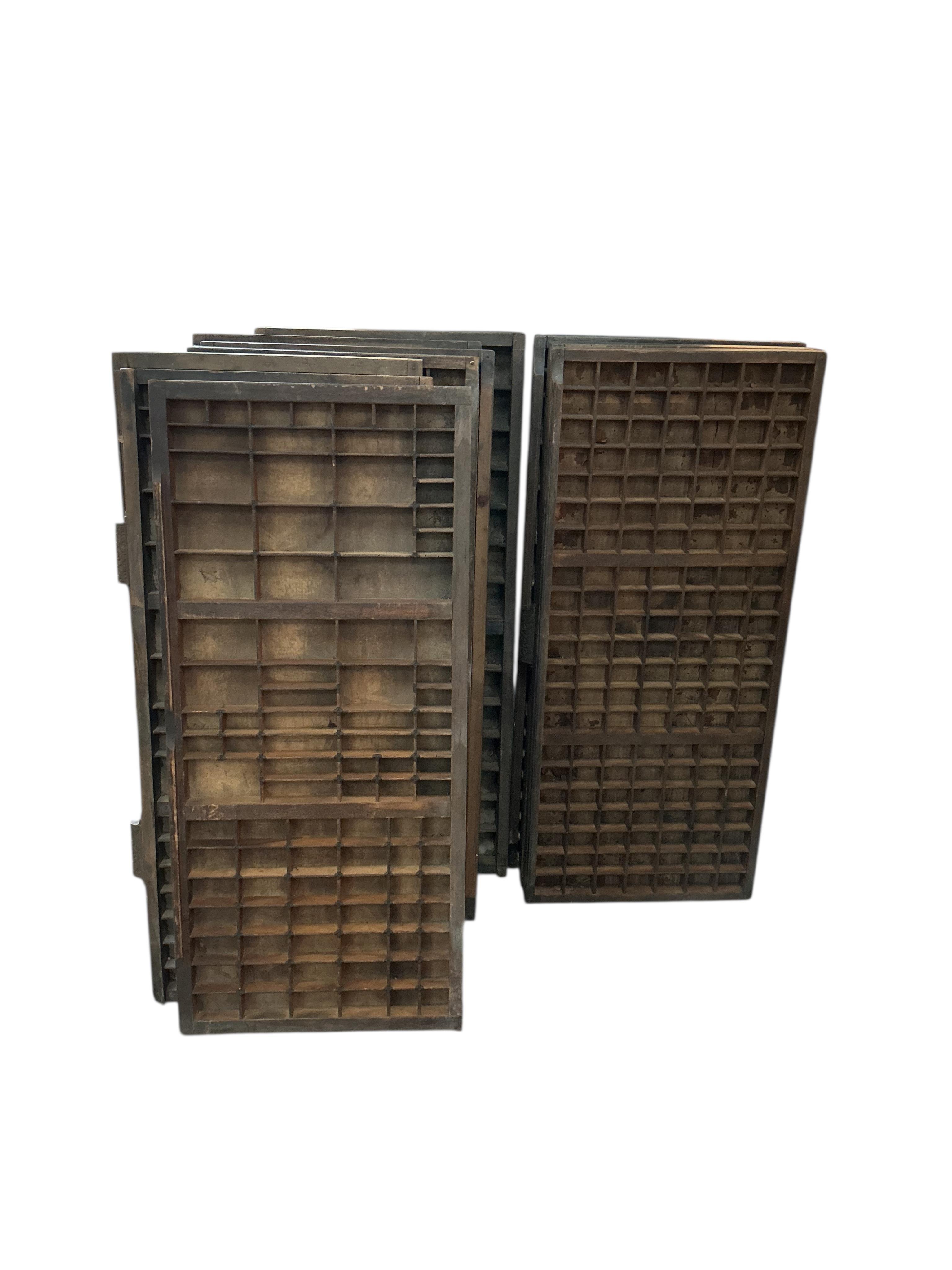 Ten printer's block trays, each width 37cm, height 84cm